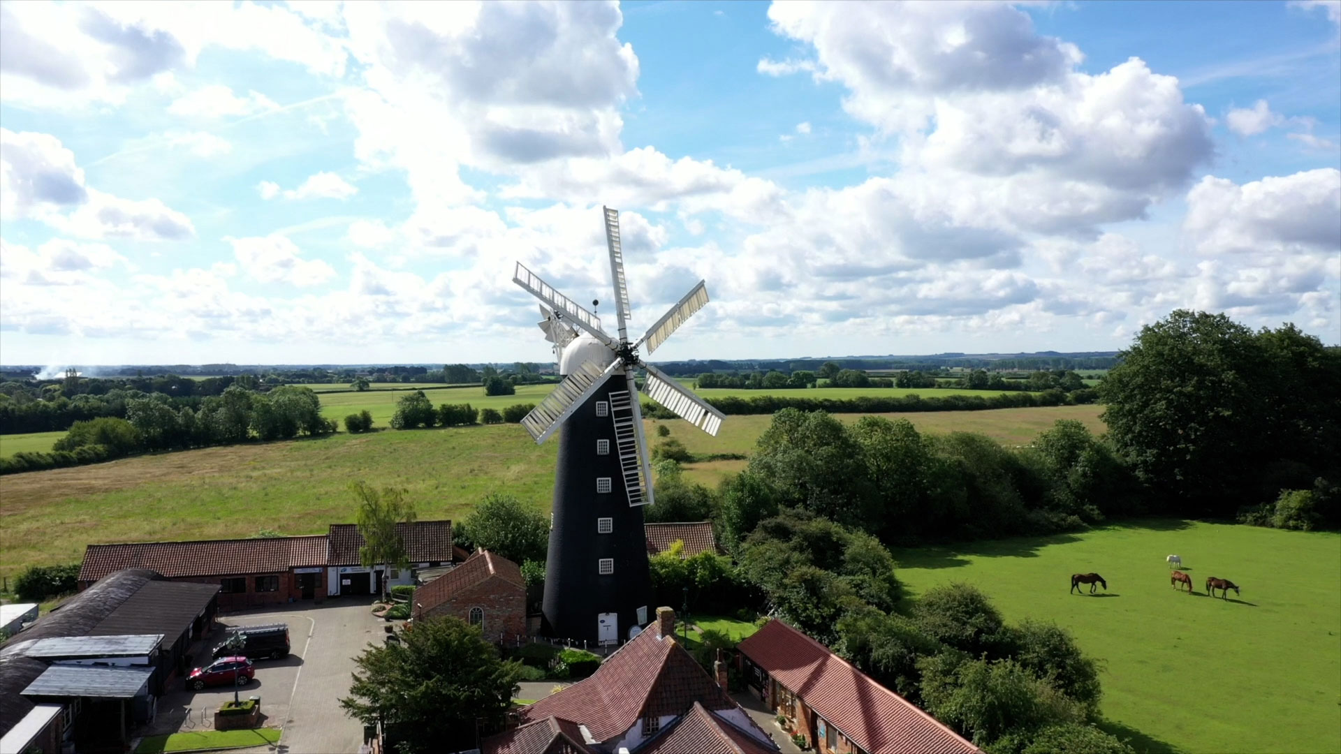 A traditional windmill surrounded by fields in the Lincolnshire Wolds